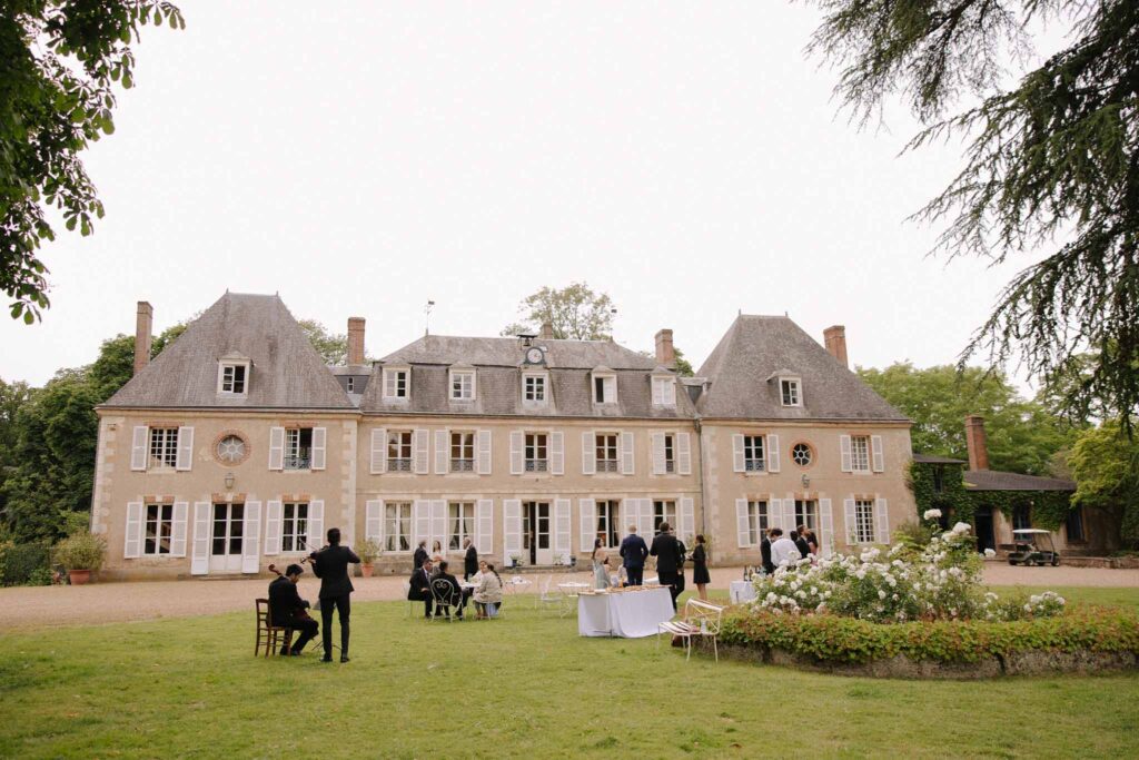 Boutonvillier F.Mary wide shot old vintage chateau guests outside