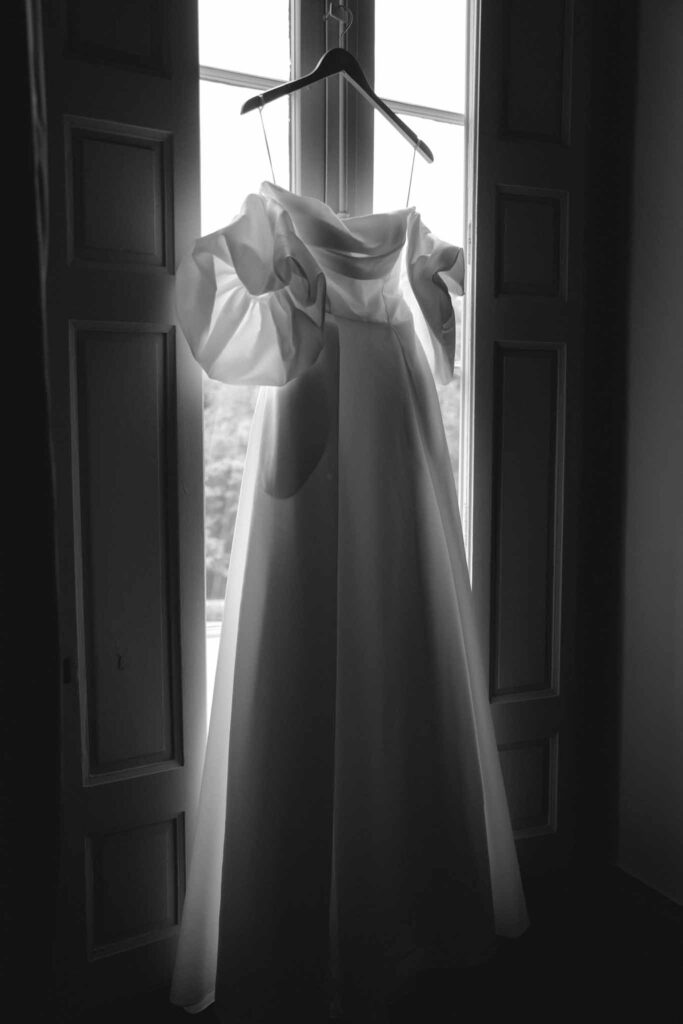 Chateau de Martinay Despinoy Wedding bride dress hanging by window black white photo