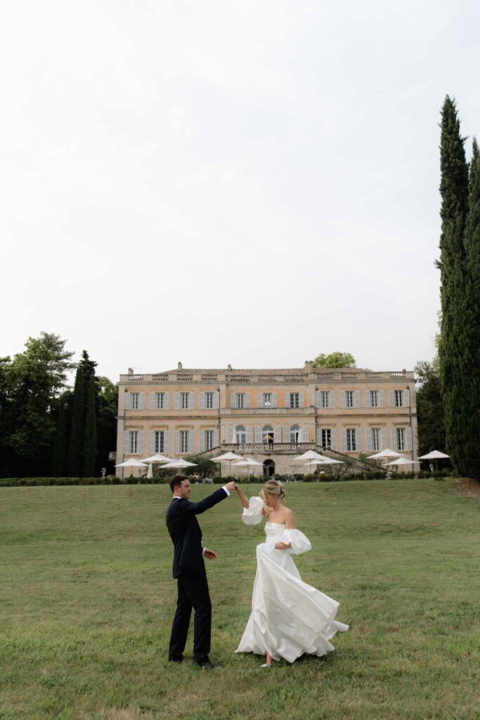 Chateau de Martinay Despinoy Wedding bride groom dancing outside open field reception