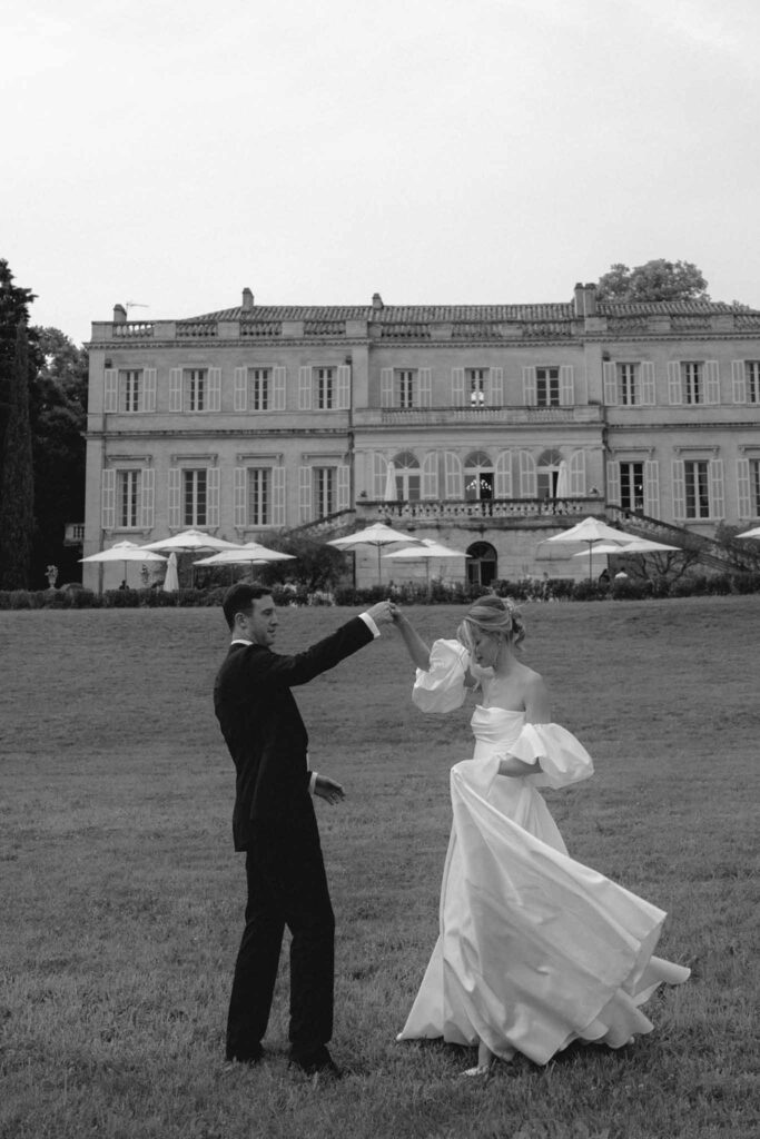 Chateau de Martinay Despinoy Wedding bride groom dancing outside open field reception background black white photo