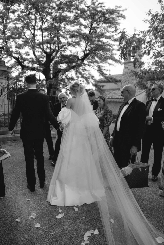 Chateau de Martinay Despinoy Wedding bride groom greeted by guests black white photo