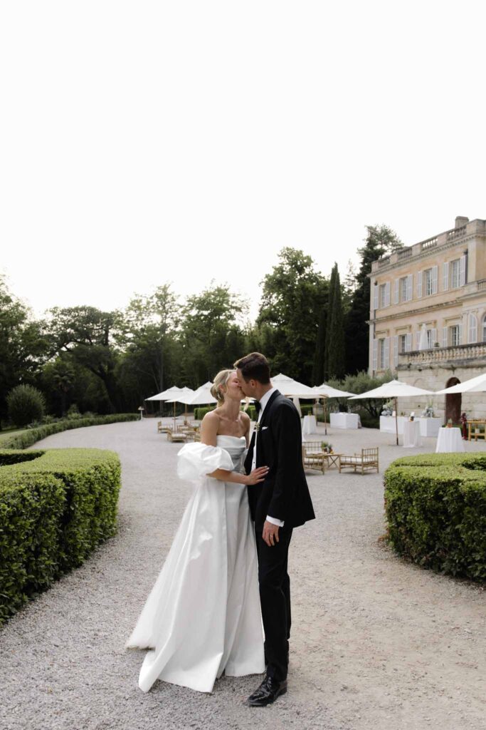 Chateau de Martinay Despinoy Wedding bride groom kissing outside venue background