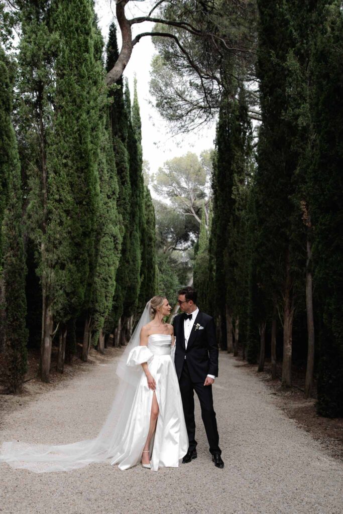 Chateau de Martinay Despinoy Wedding bride groom looking each other high slit dress black tux long veil