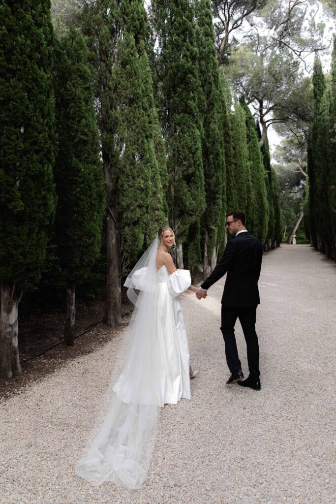 Chateau de Martinay Despinoy Wedding bride groom walking looking back long veil 