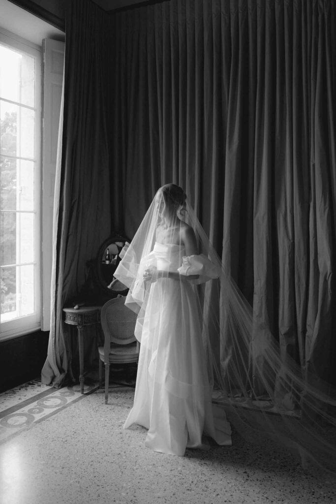 Chateau de Martinay Despinoy Wedding bride looking at outside window black white photo