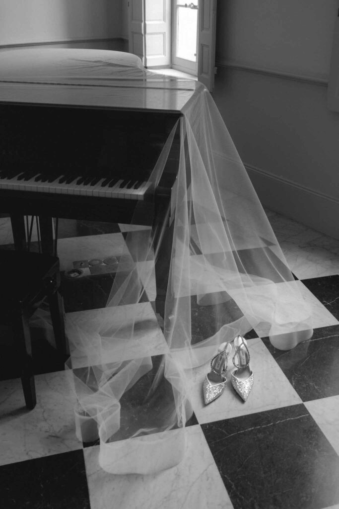 Chateau de Martinay Despinoy Wedding brides accessories shoes veil by the piano black white photo