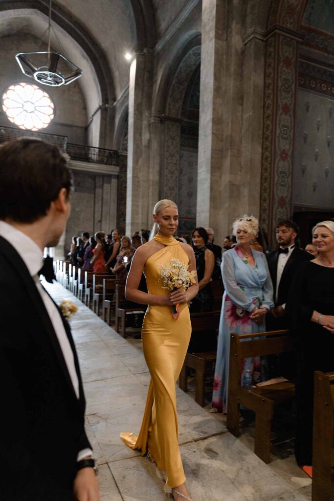 Chateau de Martinay Despinoy Wedding bridesmaid yeallow dress walking inside church