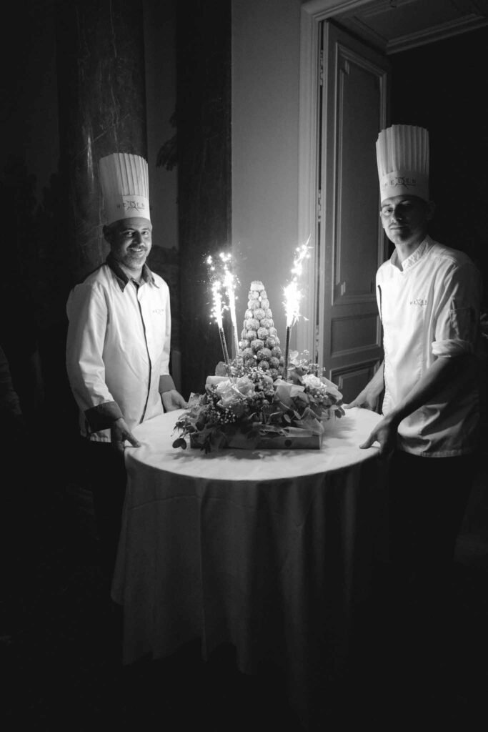 Chateau de Martinay Despinoy Wedding croquembouche getting out with sparkle table black white photo