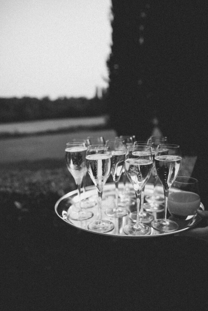 Chateau de Martinay Despinoy Wedding detail shot champagne glass in tray black white photo