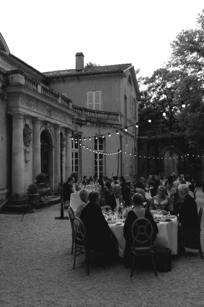 Chateau de Martinay Despinoy Wedding guests seated reception table outside black white photo