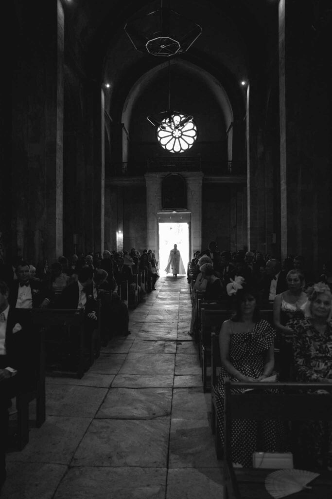 Chateau de Martinay Despinoy Wedding priests walking toward altar guests seated