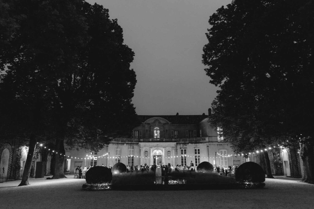 Chateau de Martinay Despinoy Wedding wide shot reception area string lights outside chateau