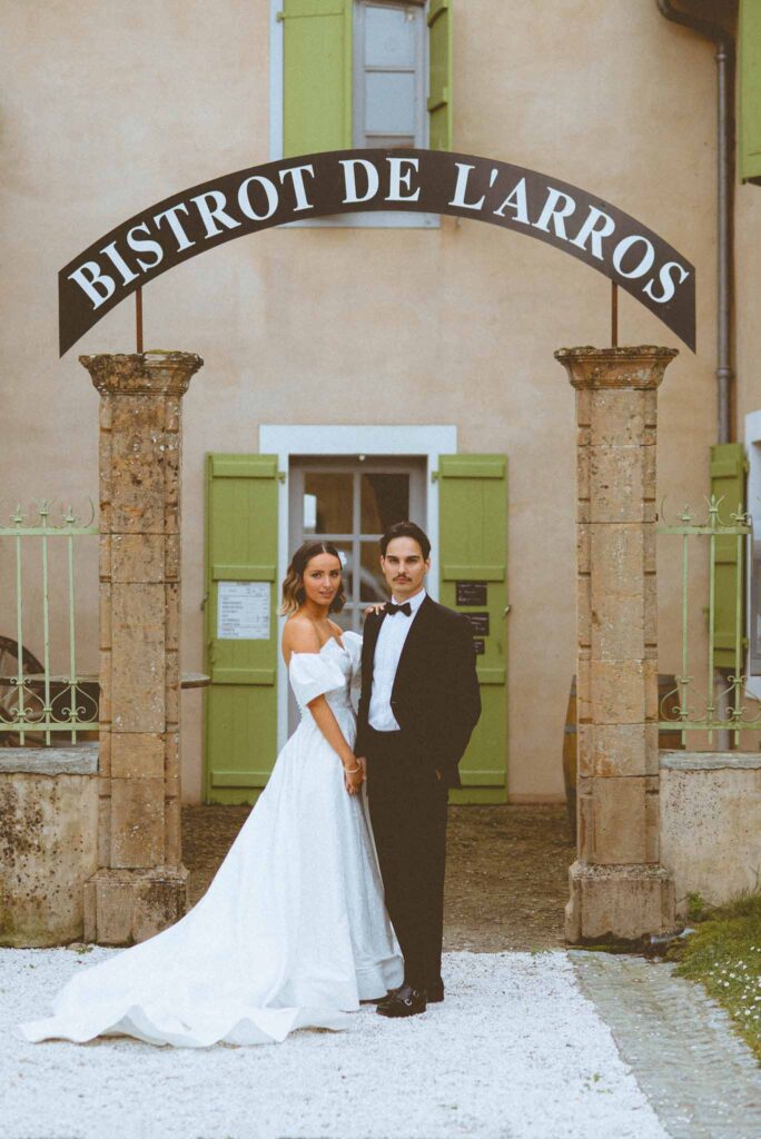 L Amour Fou 3 Maude C Photographe bride groom standing bistro background