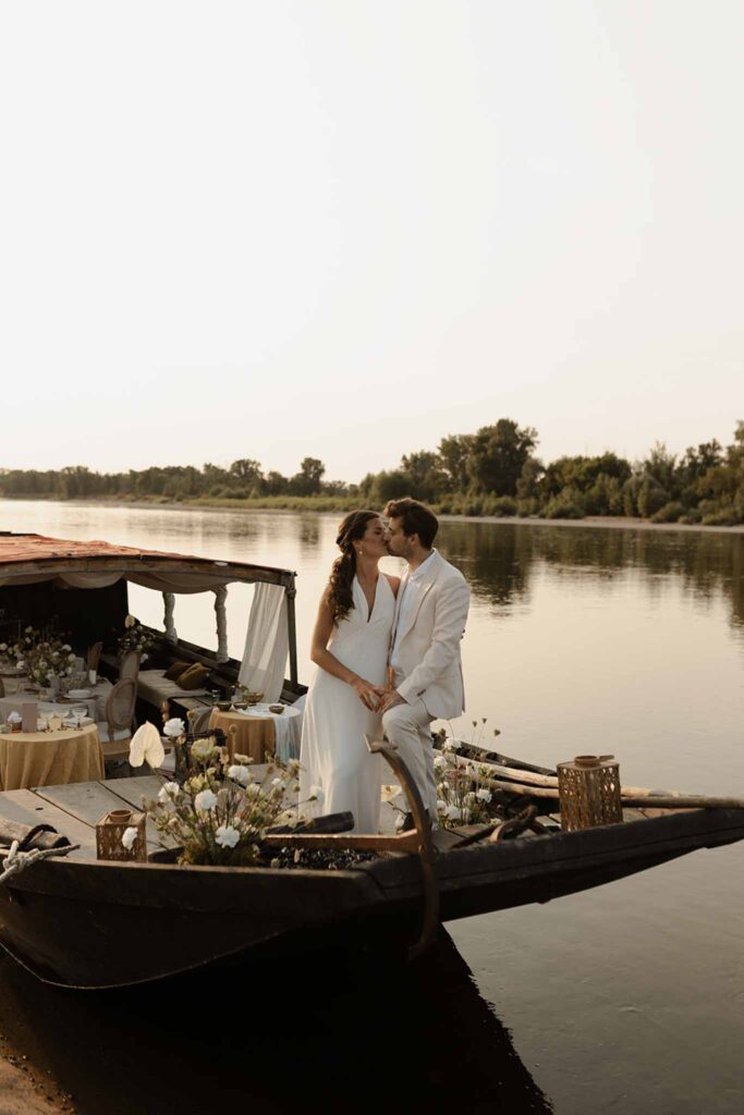 Loire Valley Il Keys bride groom kissing reception boat sunset