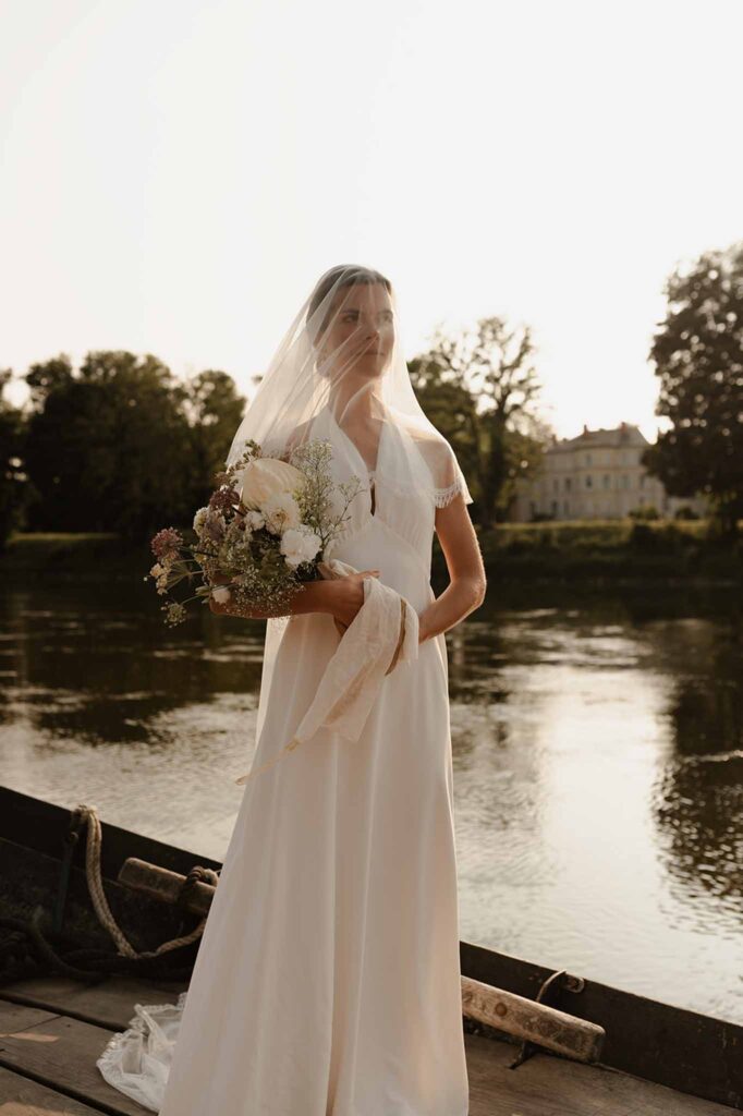 Loire Valley Il Keys bride old Hollywood gown veil face wind river background