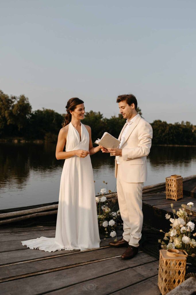 Loire Valley Il Keys groom reading vow standing boat river