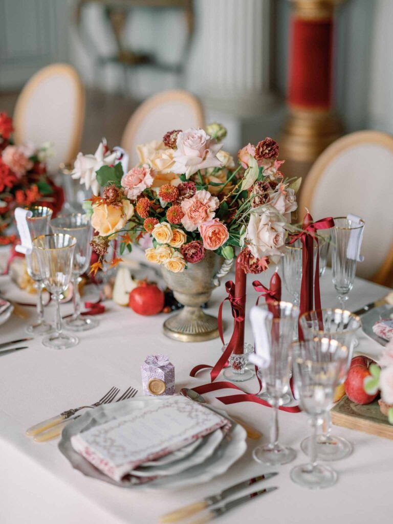 Marcellus Q.H.Quinze flower centerpiece red candles wine glass formal table arrangement