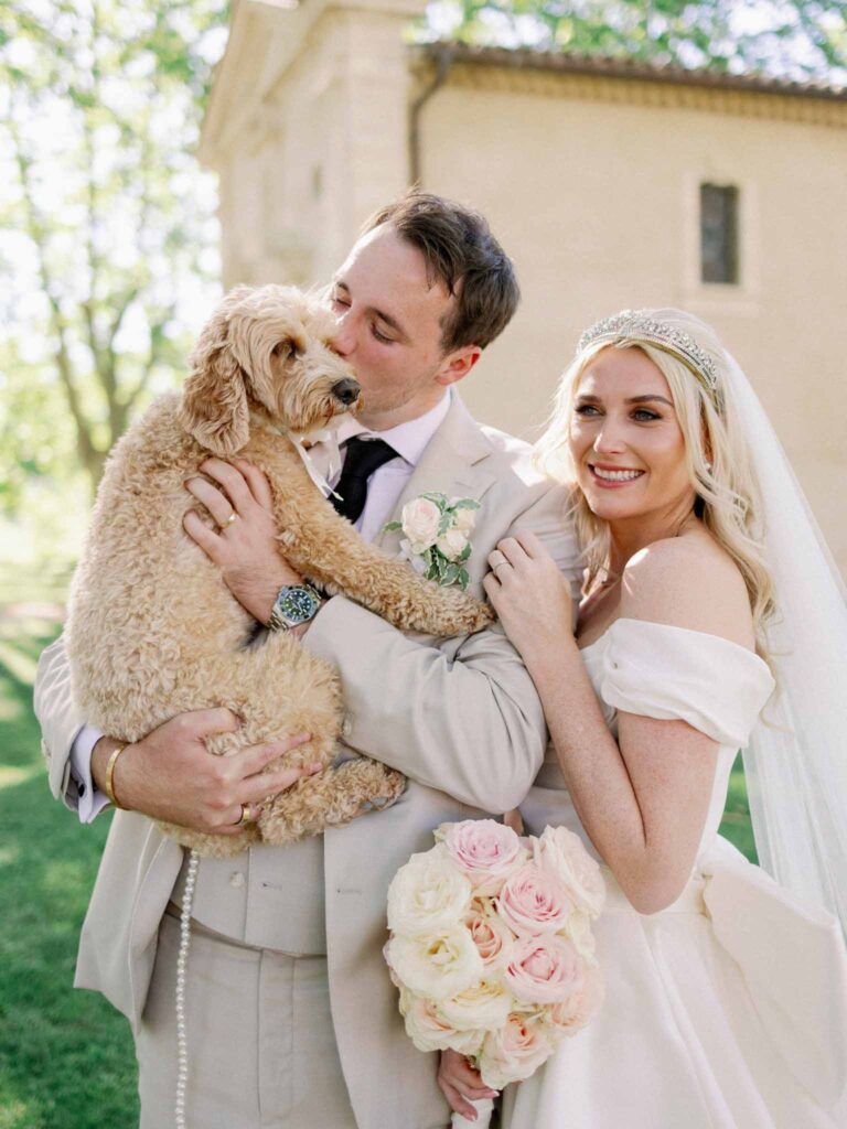 g.dominic m.marechal bride groom kissing dog close up shot