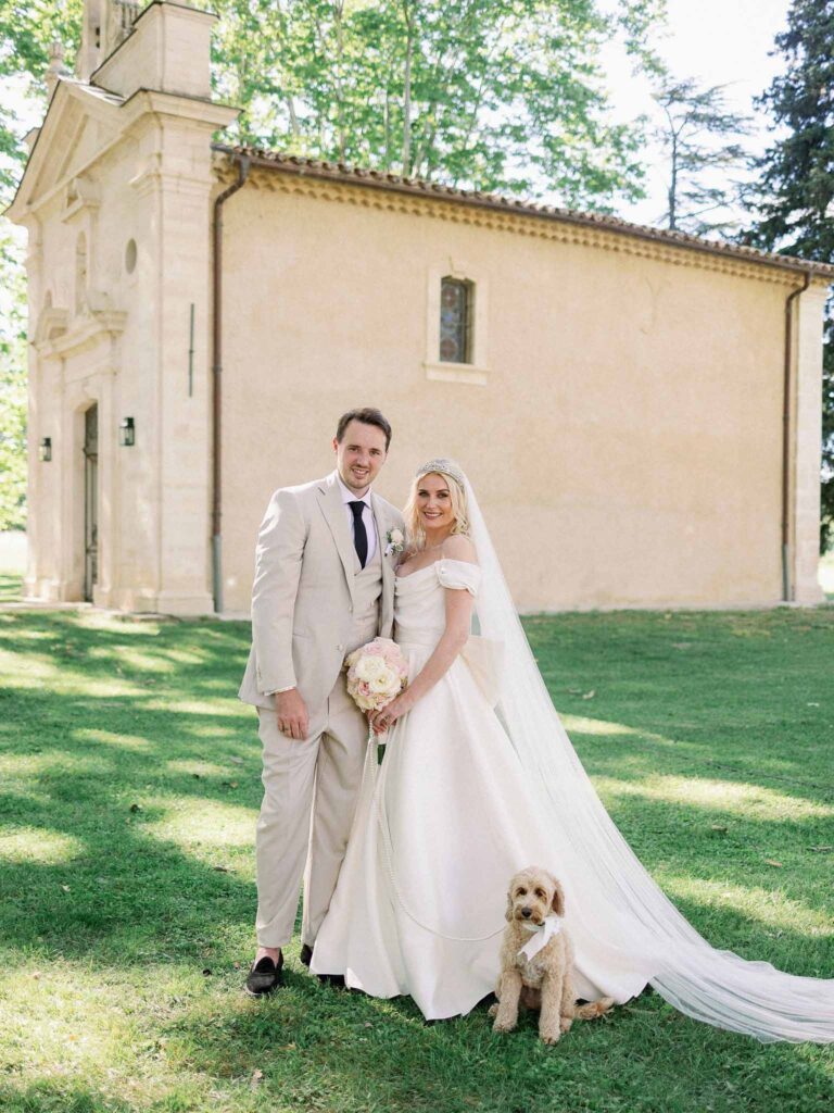 g.dominic m.marechal bride groom their dog picture together chapel background