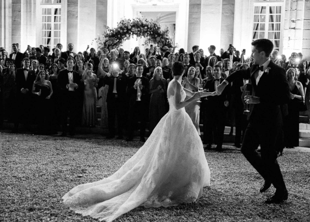 saint martin H.Clark bride groom dancing outside guests background