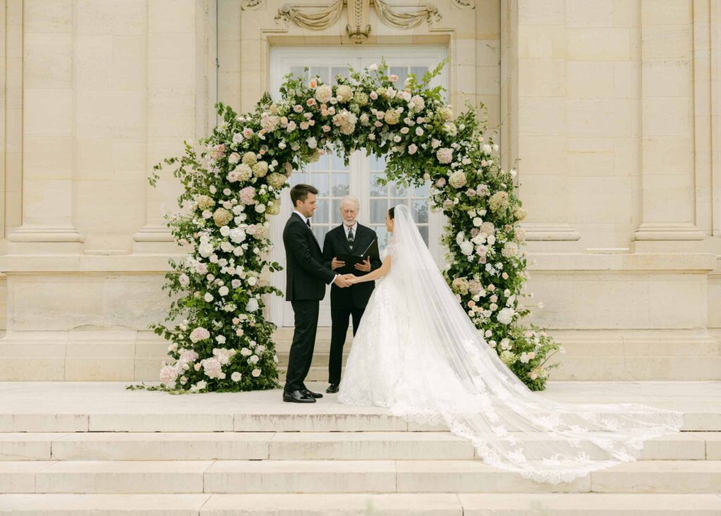 saint martin H.Clark bride groom front ceremony flower arch