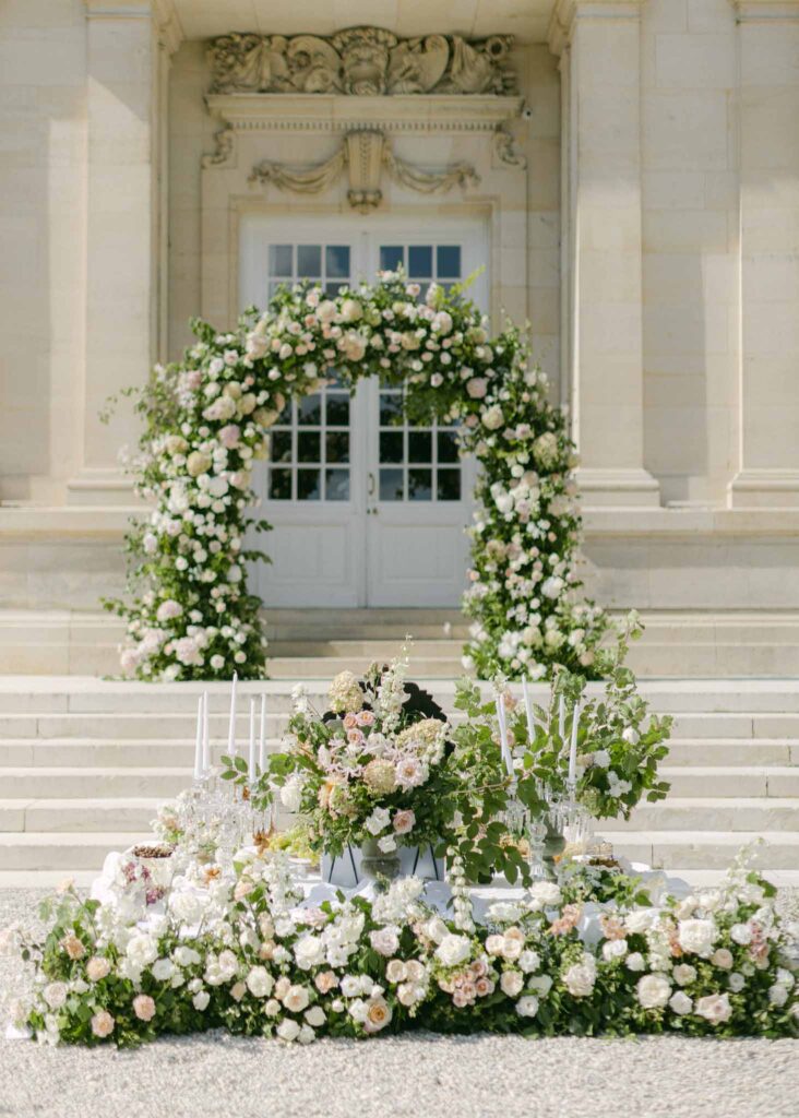 Chateau de Saint-Martin du Tertre arch flower decor stairs ceremony