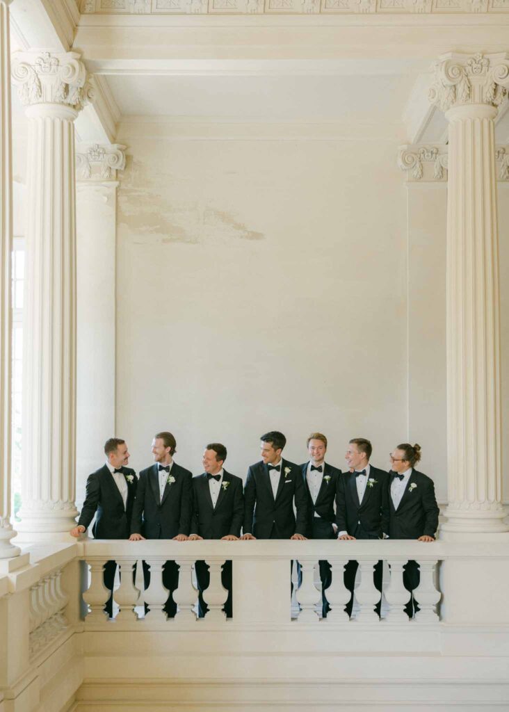 saint martin H.Clark groom groomsmen black tuxedo lined up