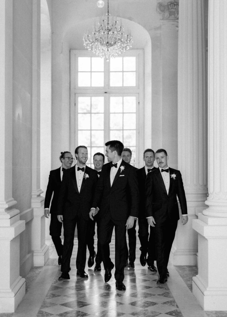 saint martin H.Clark groom groomsmen hallway walking chateau