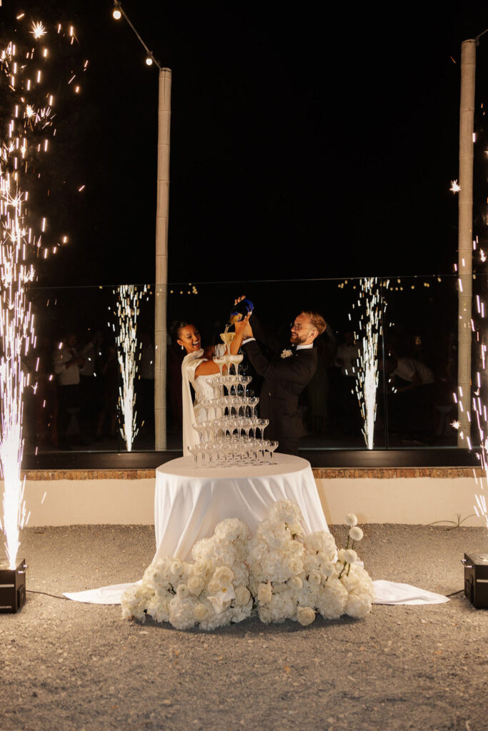 Bastide du Roy J.Jellet bride groom puring champagne glass tower