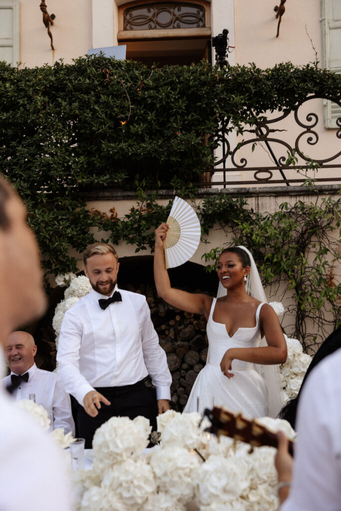 Bastide du Roy J.Jellet bride holding white fan dancing groom standing