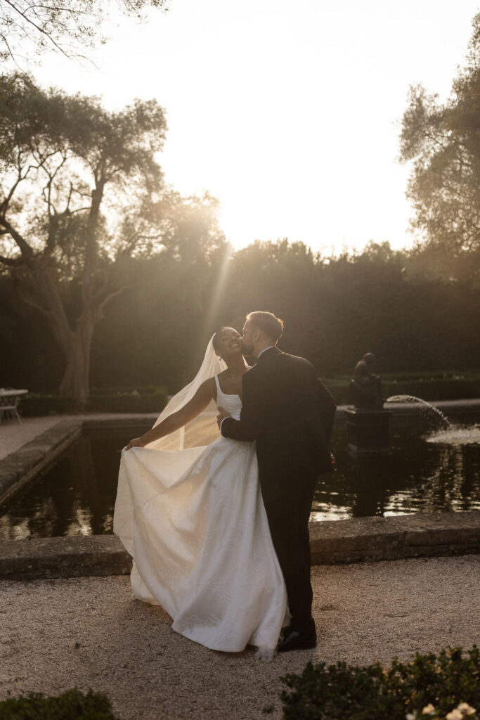 Bastide du Roy J.Jellet groom kissing cheeks bride sunset