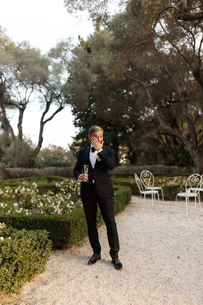 Bastide du Roy J.Jellet groom wiping tears holding champagne glass