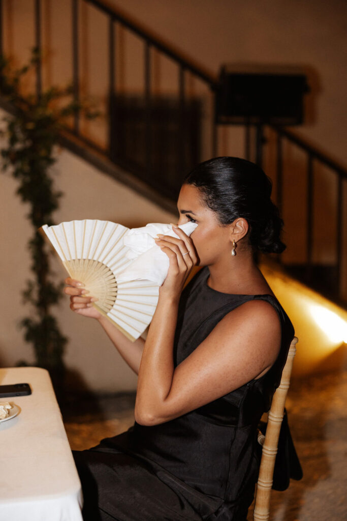 Bastide du Roy J.Jellet guests sitting holding fan wiping tears