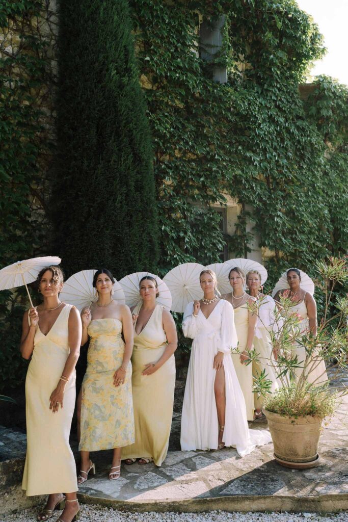 Clos d Hullias Ozaria bride bridesmaids holding white japanese umbrellas lined up