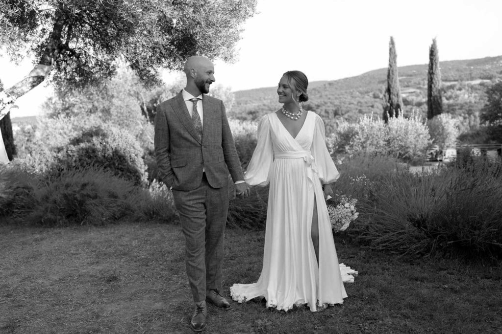 Clos d Hullias Ozaria bride groom holding hands looking each other black white photo