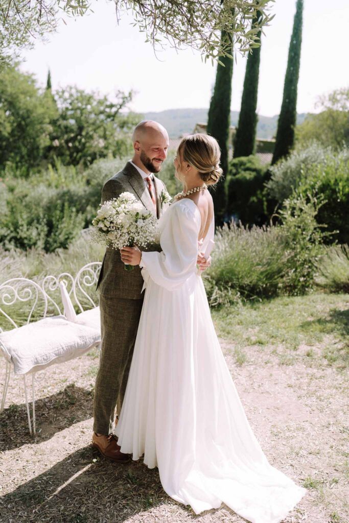 Clos d Hullias Ozaria bride groom hugging looking each other brown tux