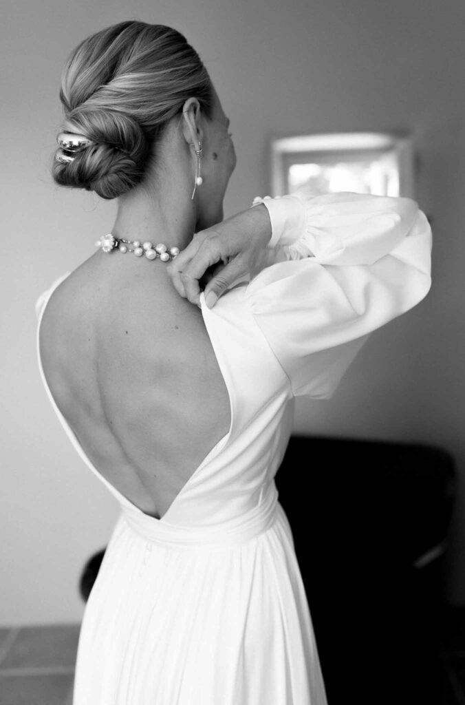 Clos d Hullias Ozaria bride low bun hair low back dress detail shot black white photo