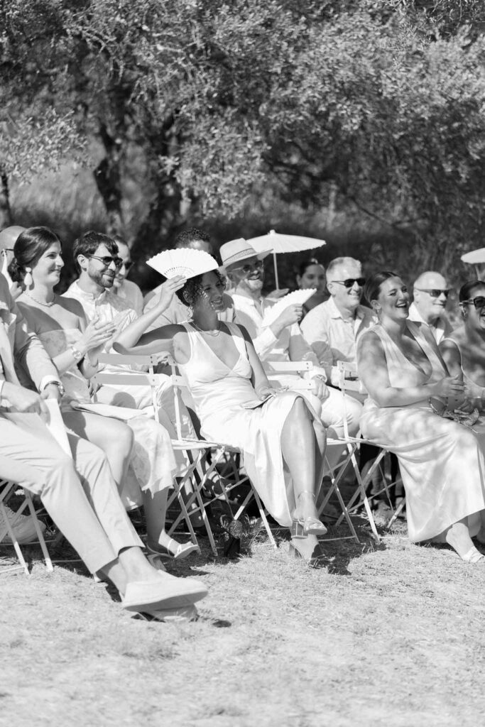 Clos d Hullias Ozaria ceremony proper guests seated umbrella black white photo