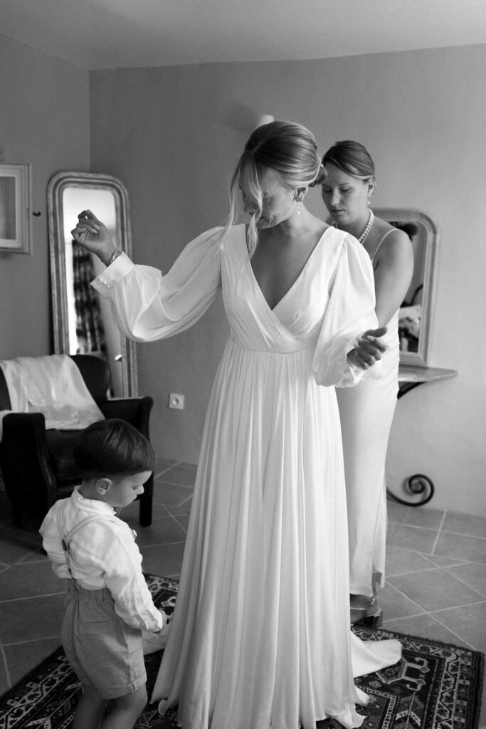 Clos d Hullias Ozaria flatlay bride getting ready fixing dress black white photo