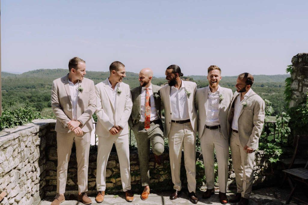 Clos d Hullias Ozaria groom groomsmen khaki cream tuxedo looking each other