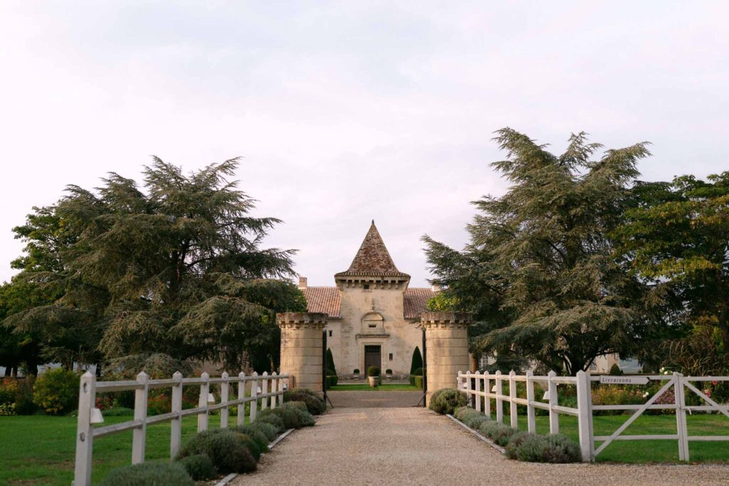 Soulac E.Jane old castle like building tower gate fence white green field