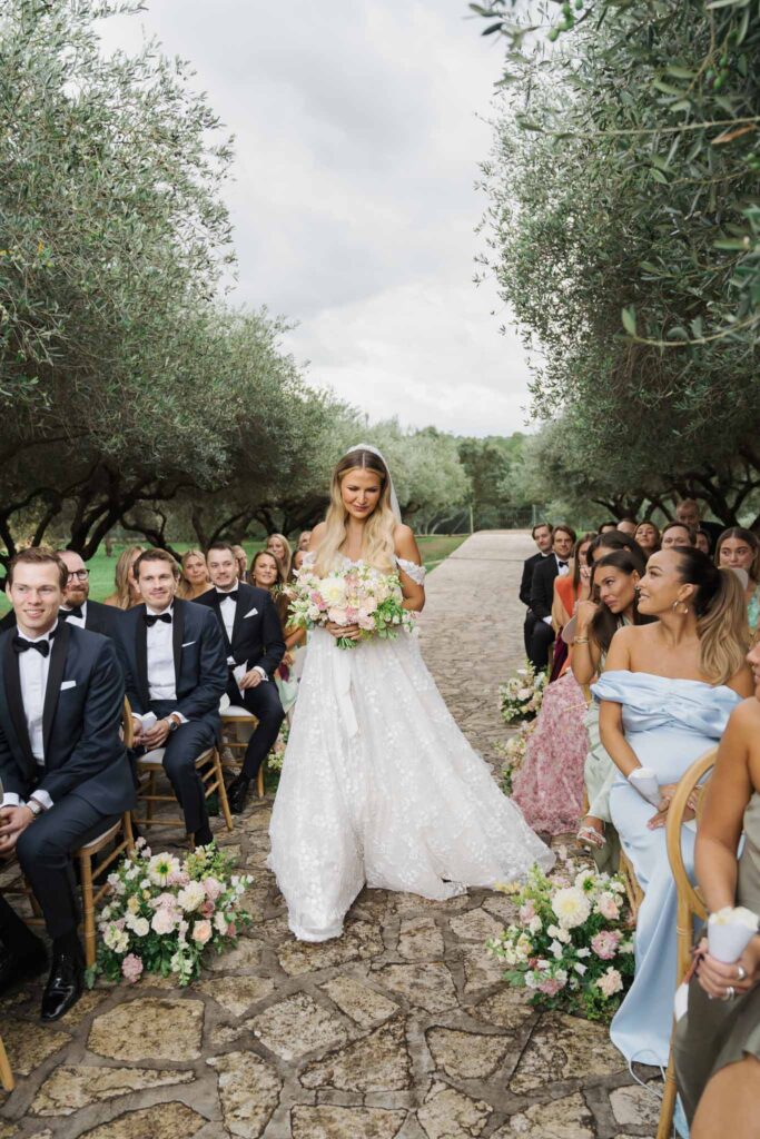 lesCrostes Ingrid bride walking down aisle guests seated