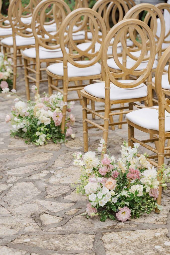 lesCrostes Ingrid detail shot wood circular chair pink white flower aisle