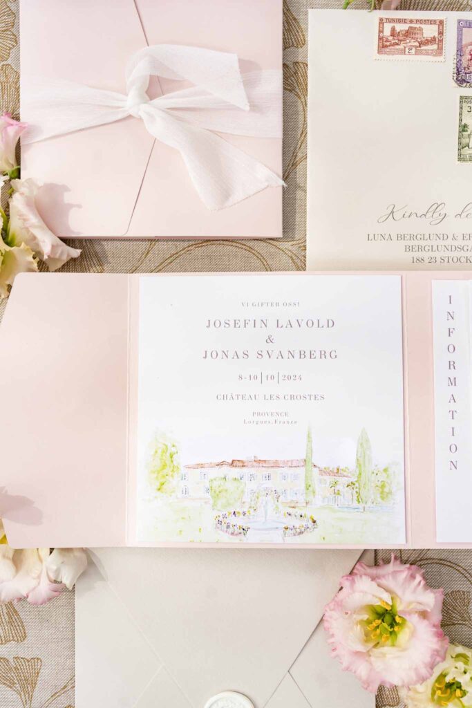 lesCrostes Ingrid flatlay invitation blush pink accents flower ribbon close up