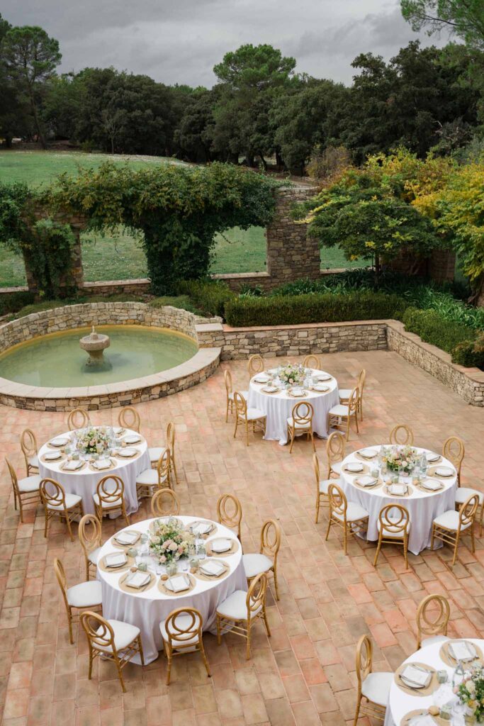 lesCrostes Ingrid wide shot reception circular tables wood chairs