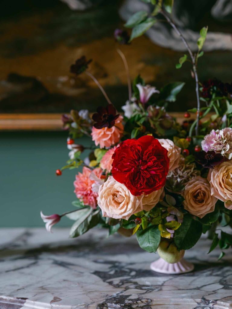 Manoir de Vacheresse Capucine detail shot flower in vintage vase close up