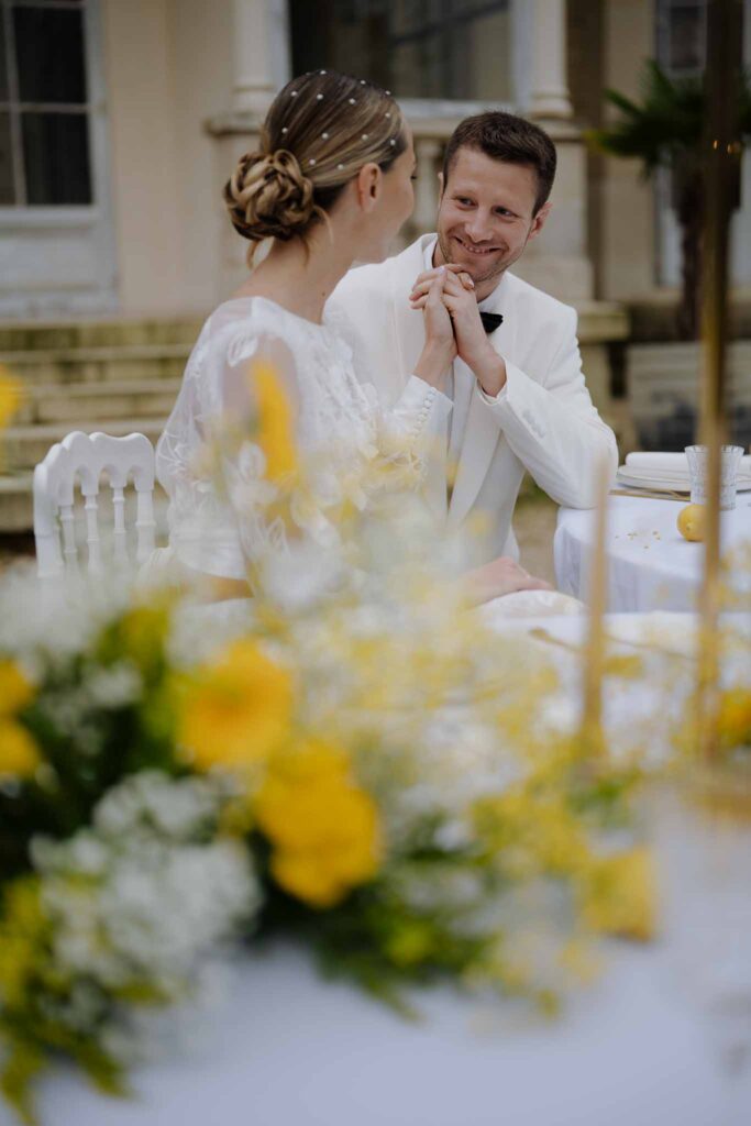 Prunay Theatre of Real Life n.reznik bride groom holding hands up sitting reception table