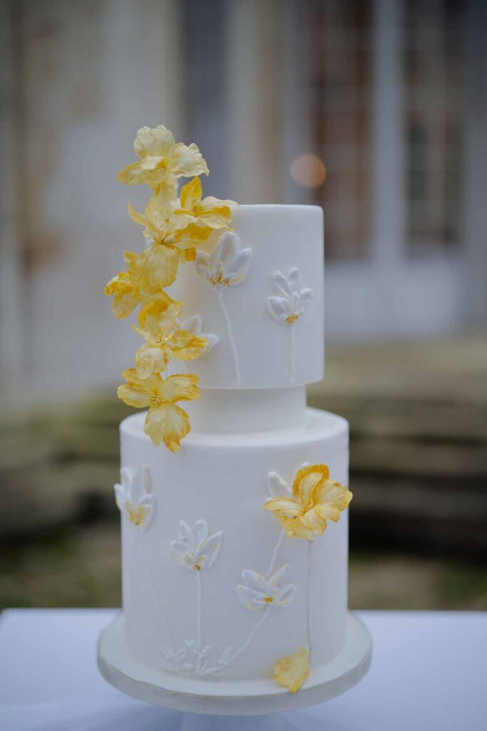 Prunay Theatre of Real Life n.reznik detail shot two tier white cake yellow flower decor design