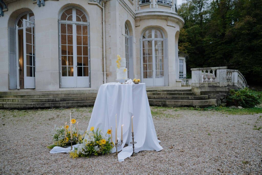 Prunay Theatre of Real Life n.reznik two tier white yellow cake old vintage house background